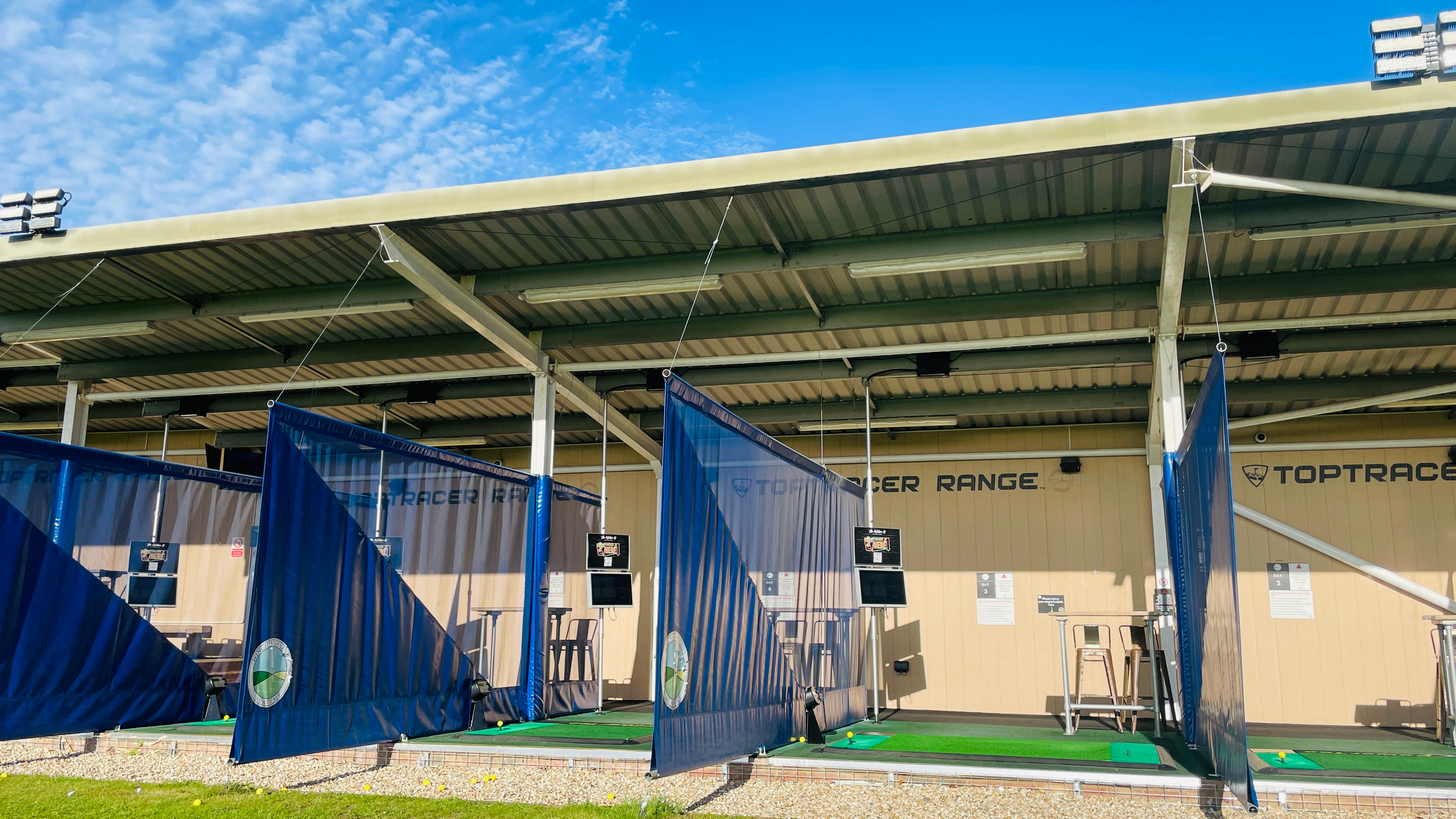 Toptracer bays at Winchester Golf Academy in daytime
